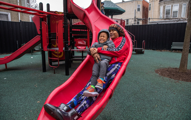 Destiney Smith enjoying the slide with her 2-year-old son Kamari.