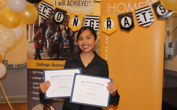 Heillen proudly displays her achievements received during the CAP graduation ceremony.
