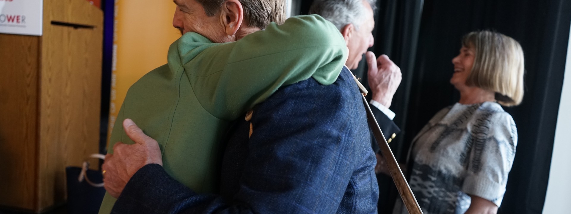 Sister Mary Scullion and John Middleton embracing