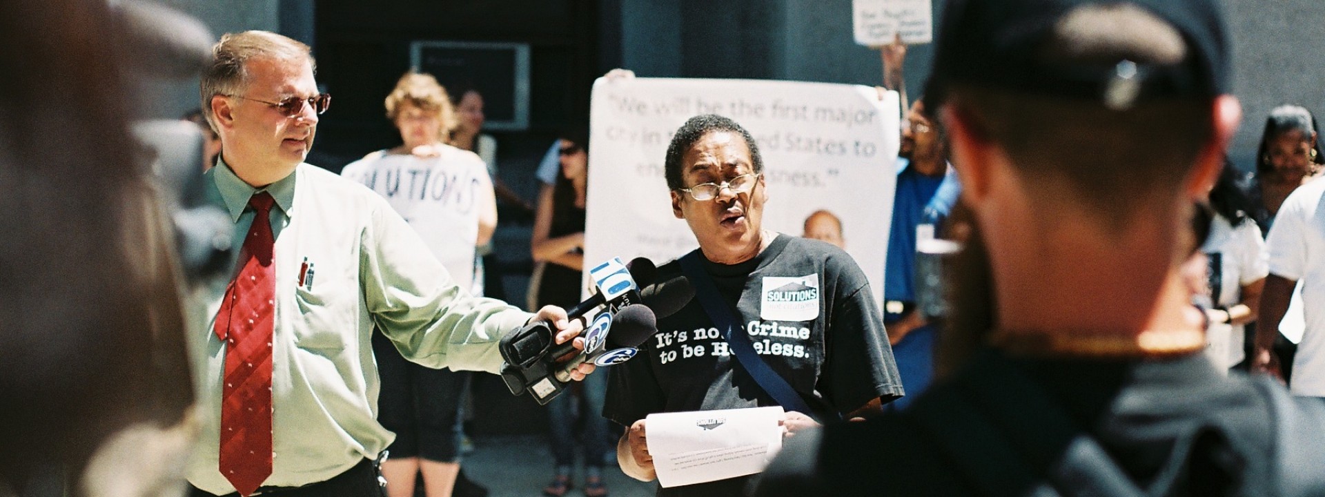 A Project HOME advocate speaking at a rally