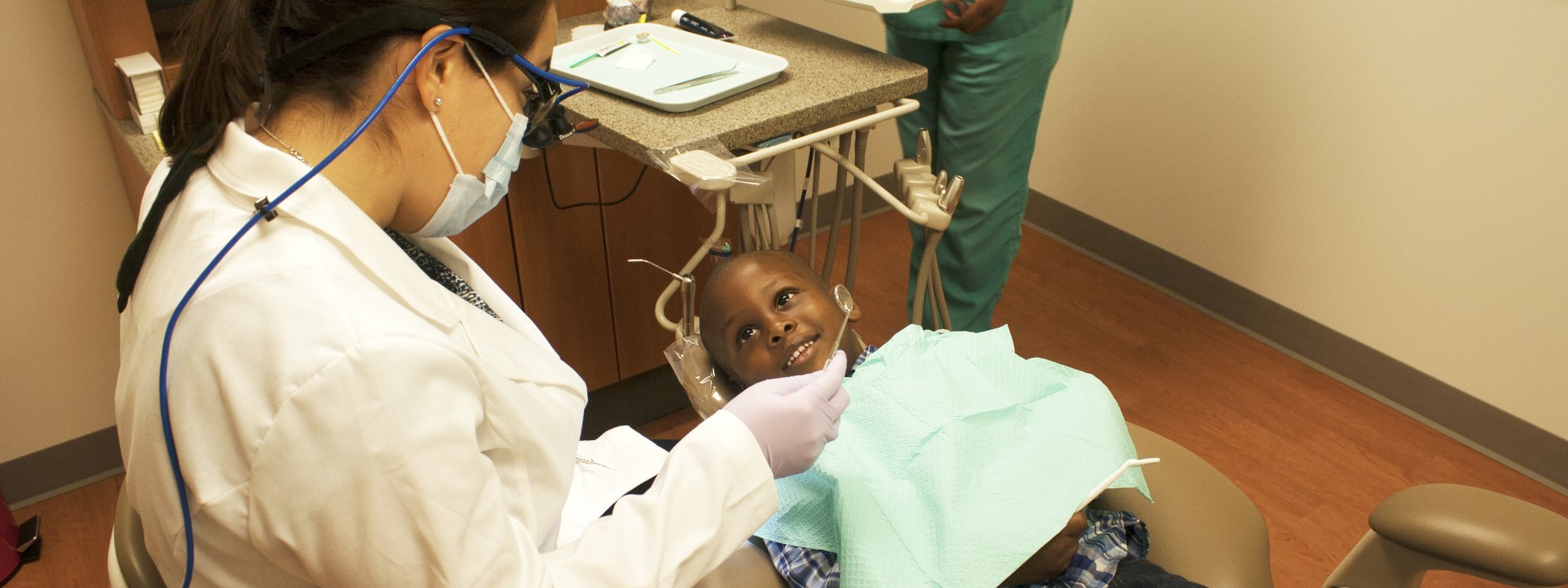 A child receives dental care at Project HOME's Stephen Klein Wellness Center.
