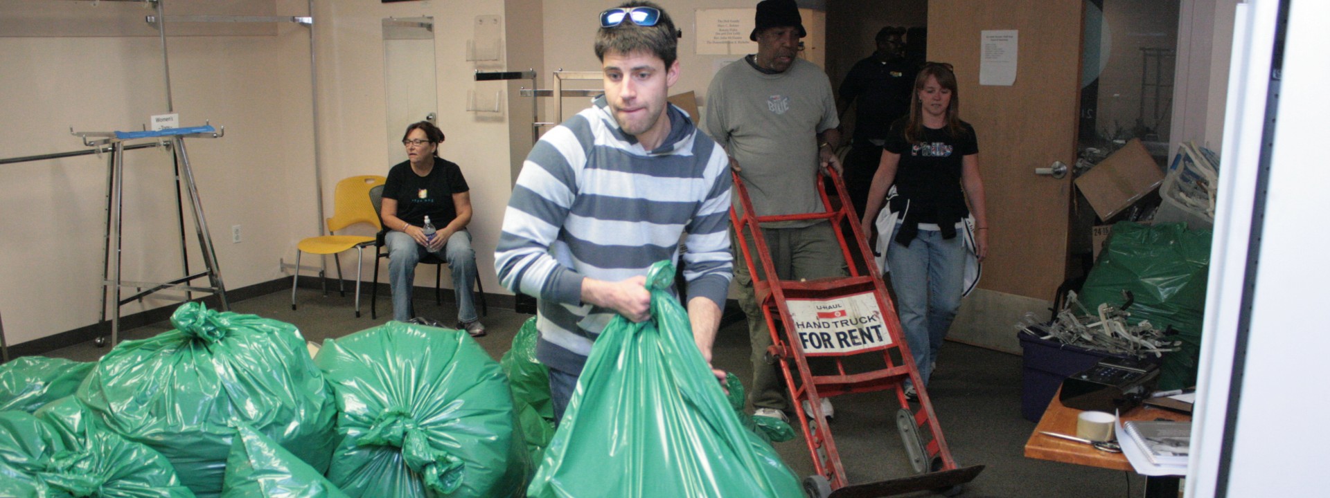 Corporate volunteers help during a clean up day