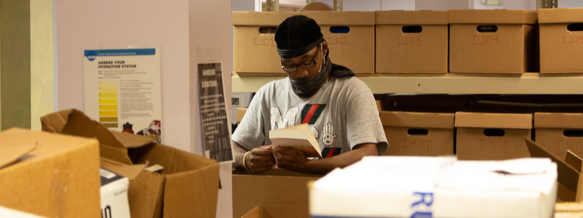 Project HOME staffer sorting books