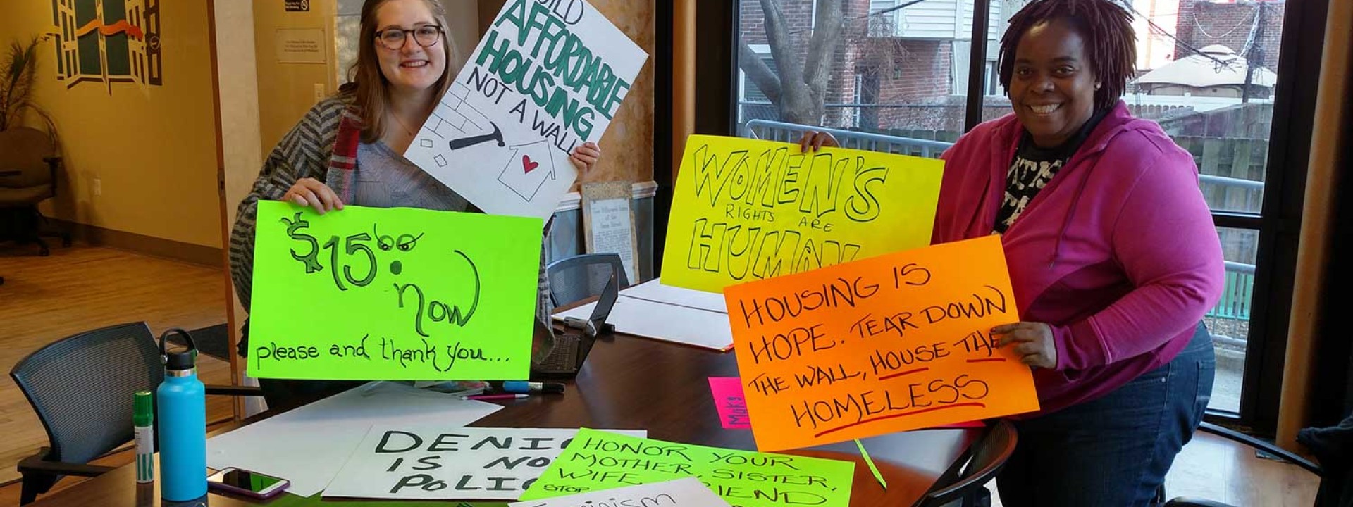 Project HOME advocates gathering signs for an action
