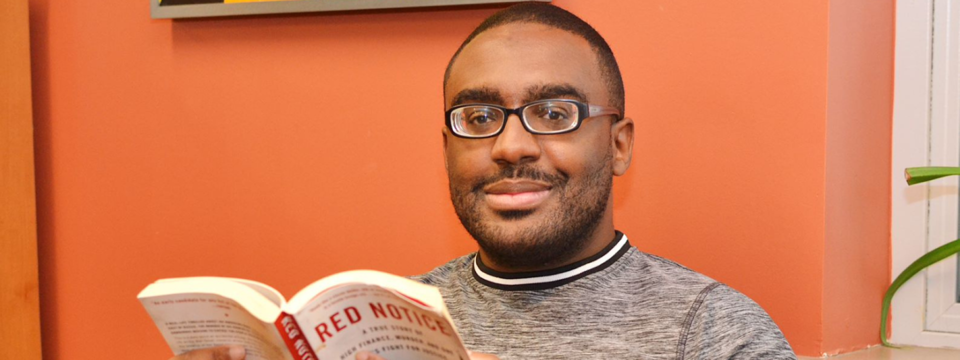Image of man reading book