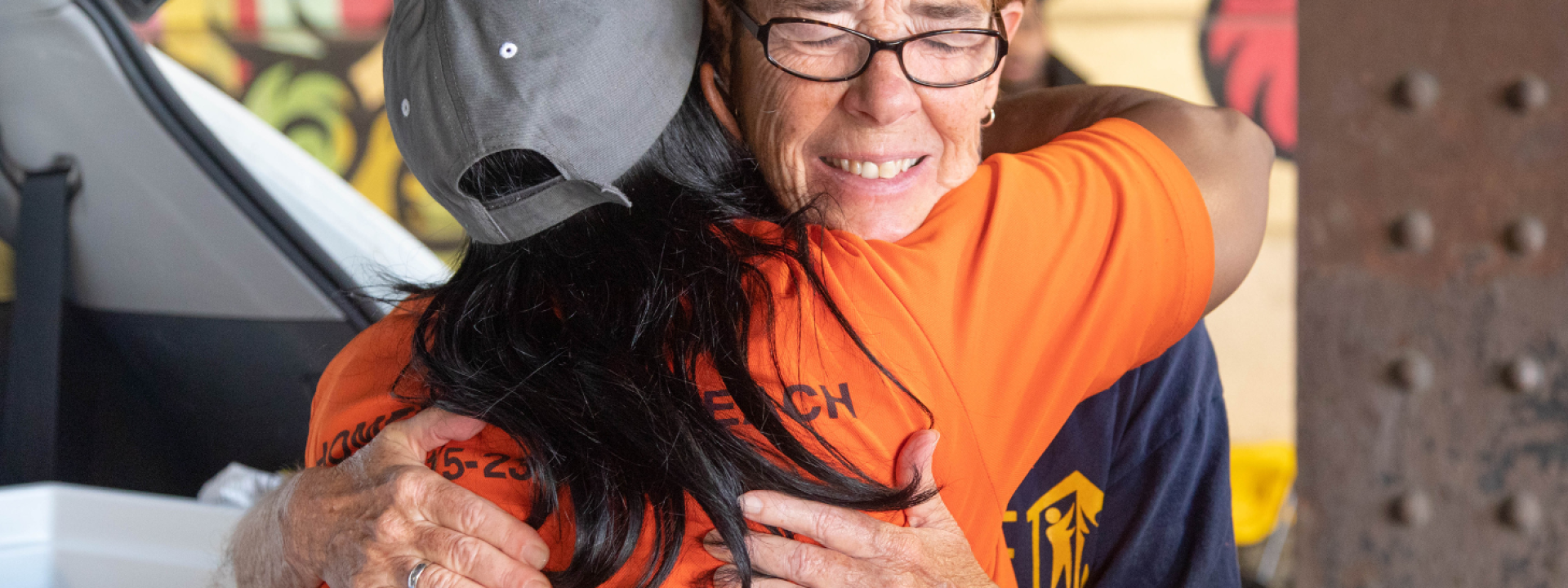 Sister Mary Scullion hugging an outreach worker