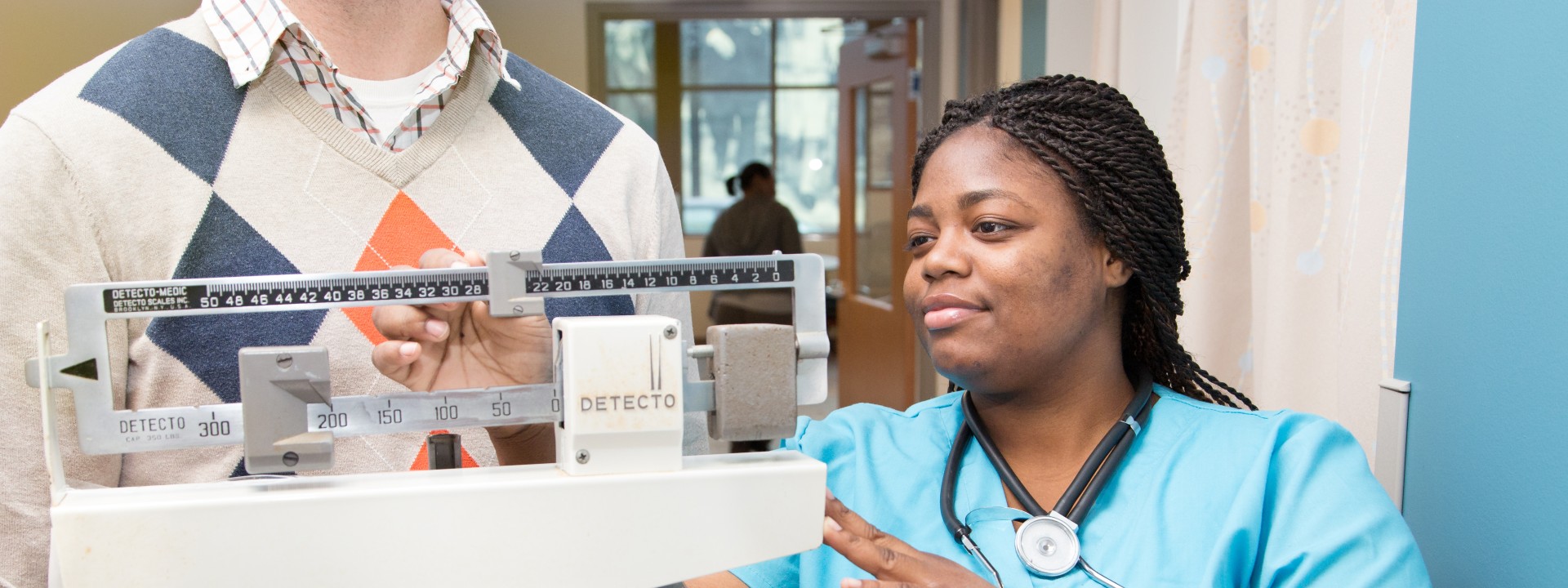 A patient receives medical care at Project HOME's Stephen Klein Wellness Center.