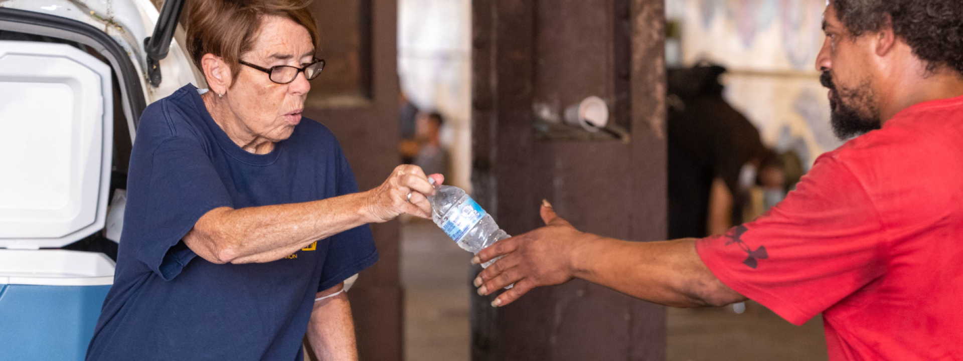 Sister Mary handing out water bottles