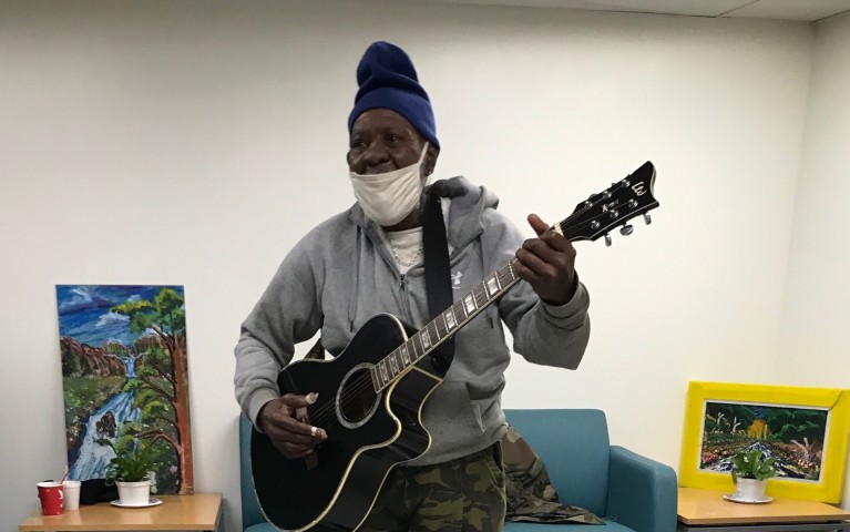 Mr. John regularly plays his guitar, Lucille, for members of the Living Room at the Hub of Hope in Suburban Station. 