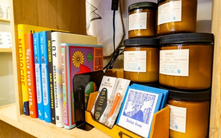 Photo of a shelf in the Omoi Zakka Shop, including Project HOMEmade's candles