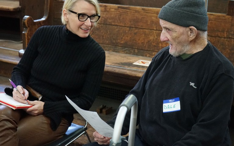 Elizabeth Gilbert speaking with a Project HOME participant