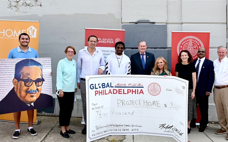 People gathered at Project HOME's Women of Change to celebrate the unveiling of a Thurgood Marshall mural