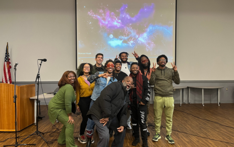 The group of audio/music adult learners strike a pose with their digital music instructor, Joe Venuti (third from the left.)