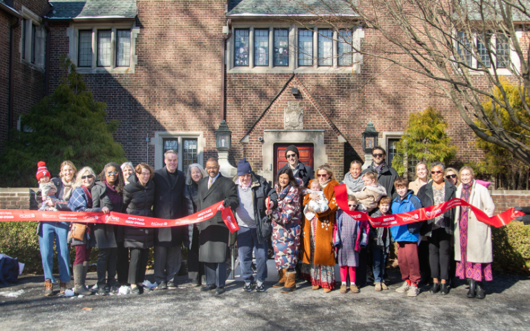 Attendees cut the ribbon at Joyce's Place grand opening