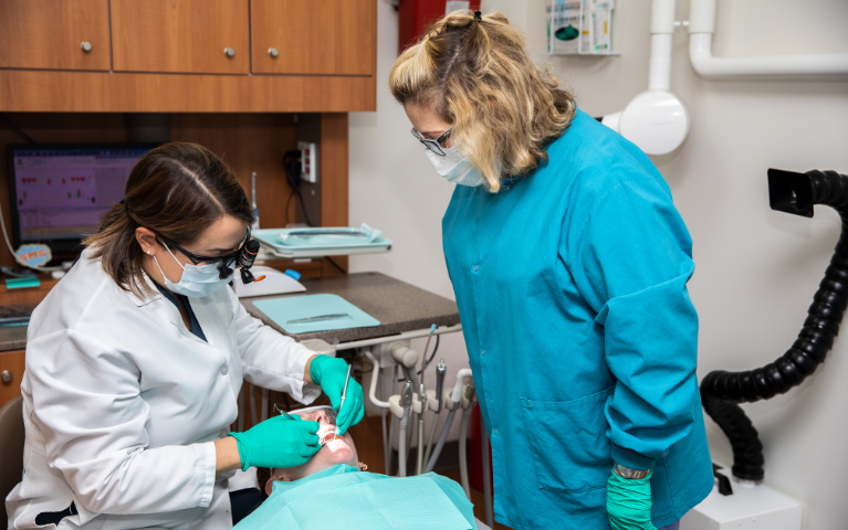 Dentists working on a patient