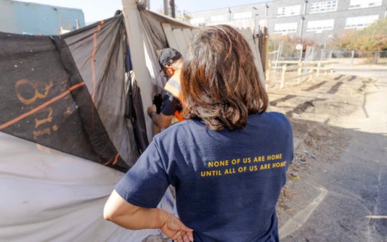 Donna and Sam, a Project HOME outreach worker, connect with a person experiencing homelessness.