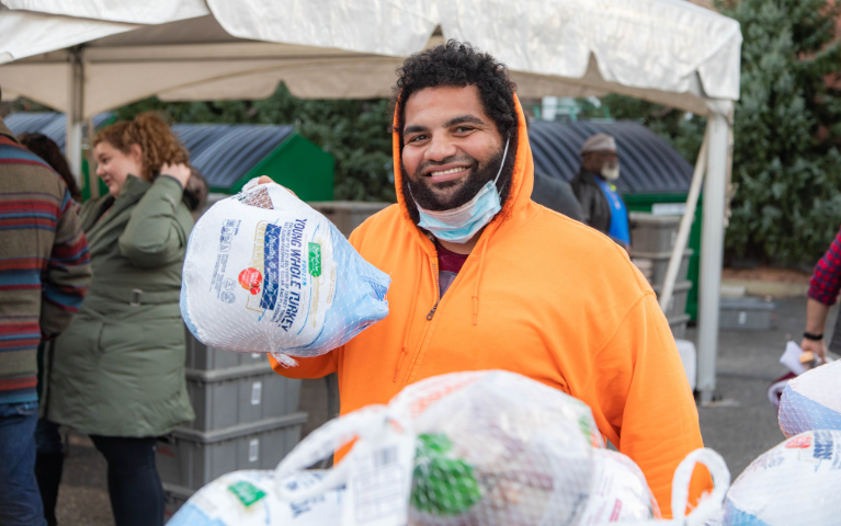 man holding a frozen turkey