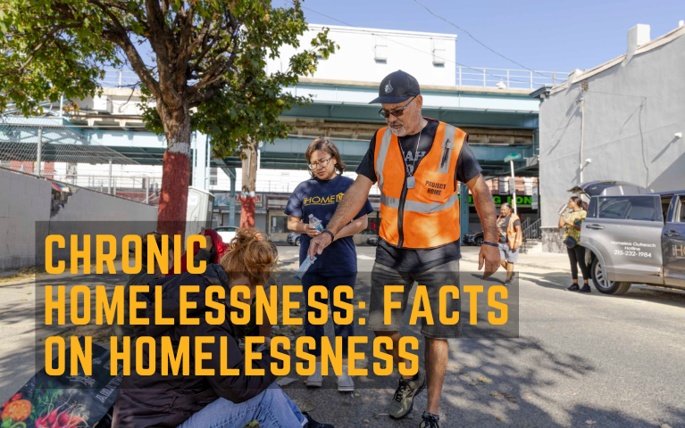 Two outreach workers attending to people experiencing homelessness.