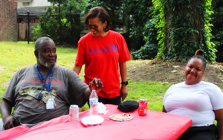 Project HOME President and CEO Donna Bullock talks with attendees of the Recovery Cookout