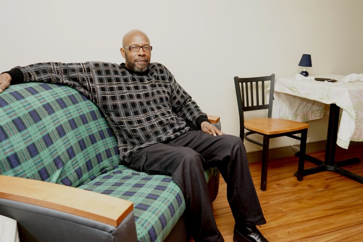 A man sitting on a sofa