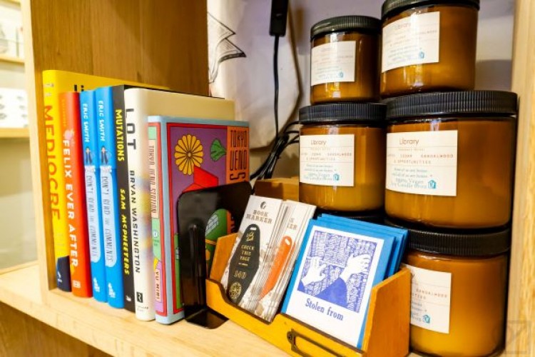 Photo of a shelf in the Omoi Zakka Shop, including Project HOMEmade's candles