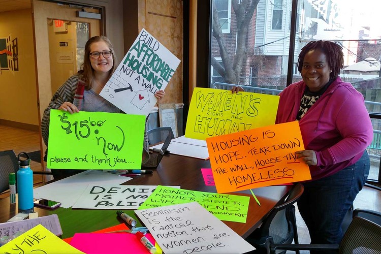 Project HOME advocates gathering signs for an action