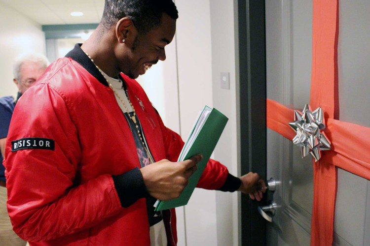 A new Project HOME resident opening their door.