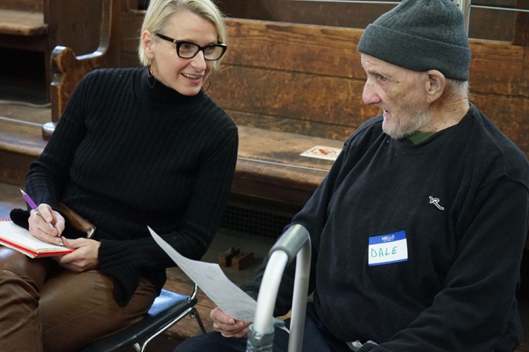 Elizabeth Gilbert speaking with a Project HOME participant