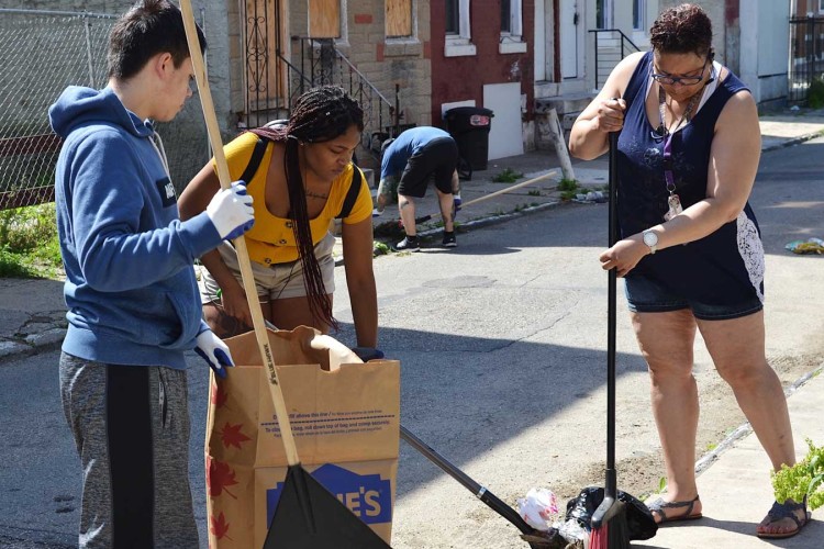 Project HOME volunteers working during a clean-up day