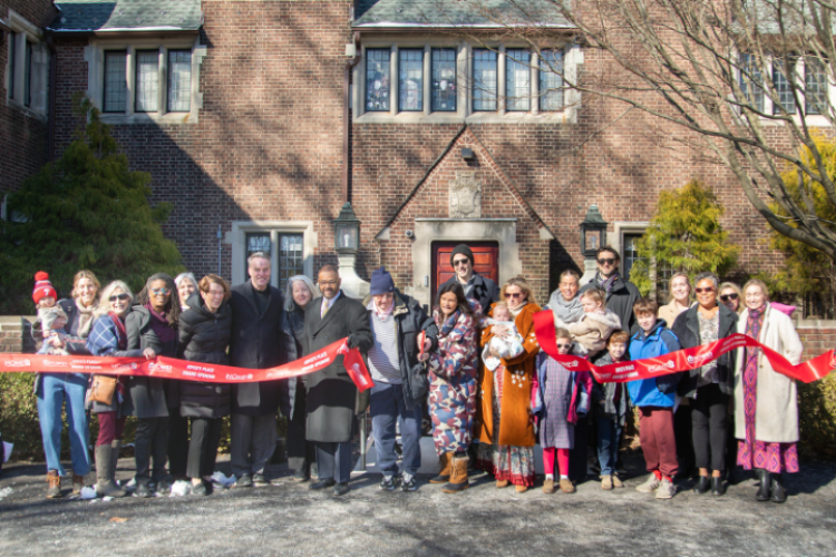 Attendees cut the ribbon at Joyce's Place grand opening