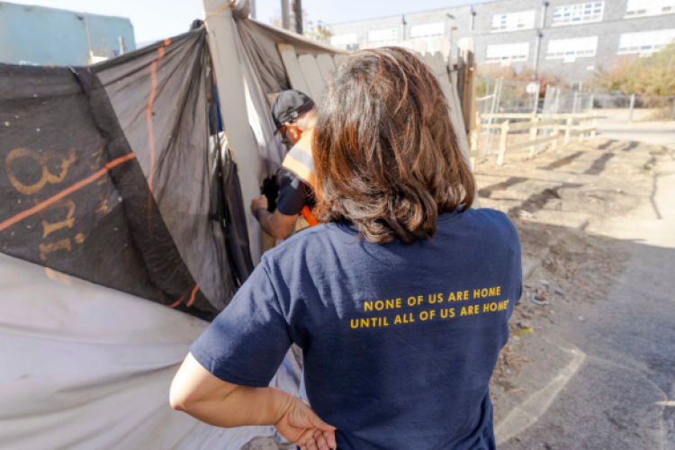 Donna and Sam, a Project HOME outreach worker, connect with a person experiencing homelessness.