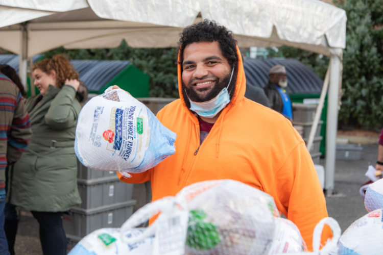 man holding a frozen turkey