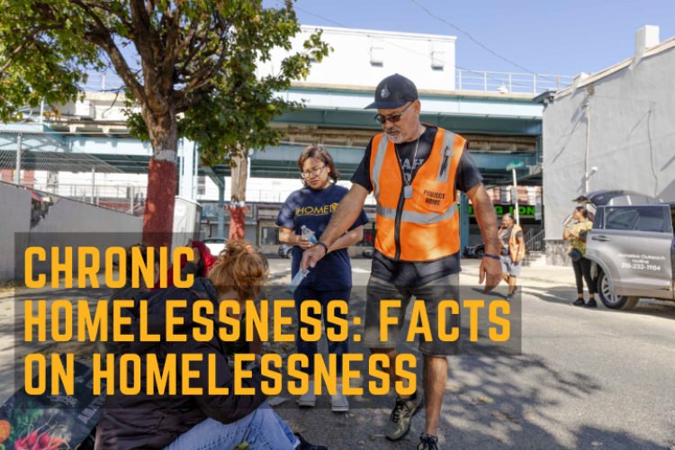 Two outreach workers attending to people experiencing homelessness.