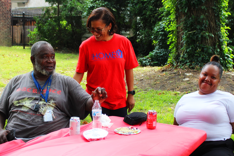 Project HOME President and CEO Donna Bullock talks with attendees of the Recovery Cookout
